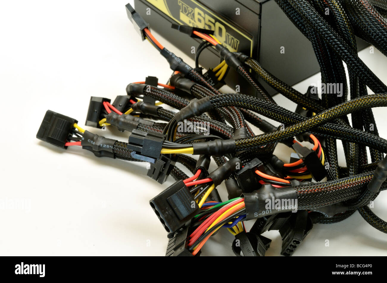 Connecting cables on computer power supply with white background Stock Photo