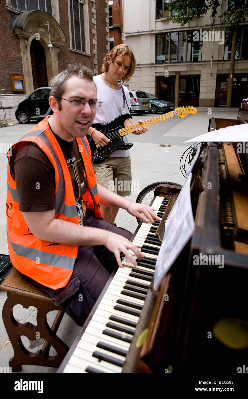 15 old pianos have been placed around the City of London as part of the City of London Festival for people to play on Stock Photo