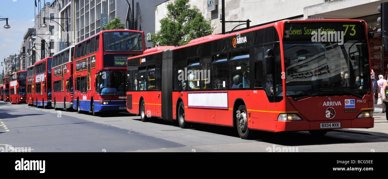 Long queue of buses in Oxford Street London with advertising panel digitally blanked out Stock Photo