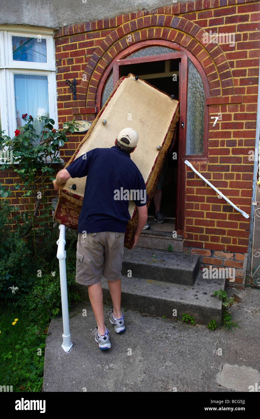 Removal Men Carrying Furniture Removal High Resolution Stock