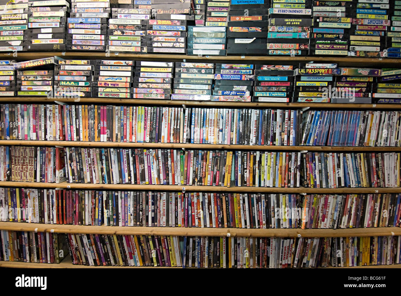 asian music tapes and cds on shelves in a shop. there is still a