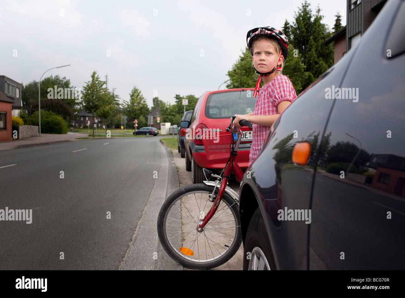 Children between cars Stock Photo