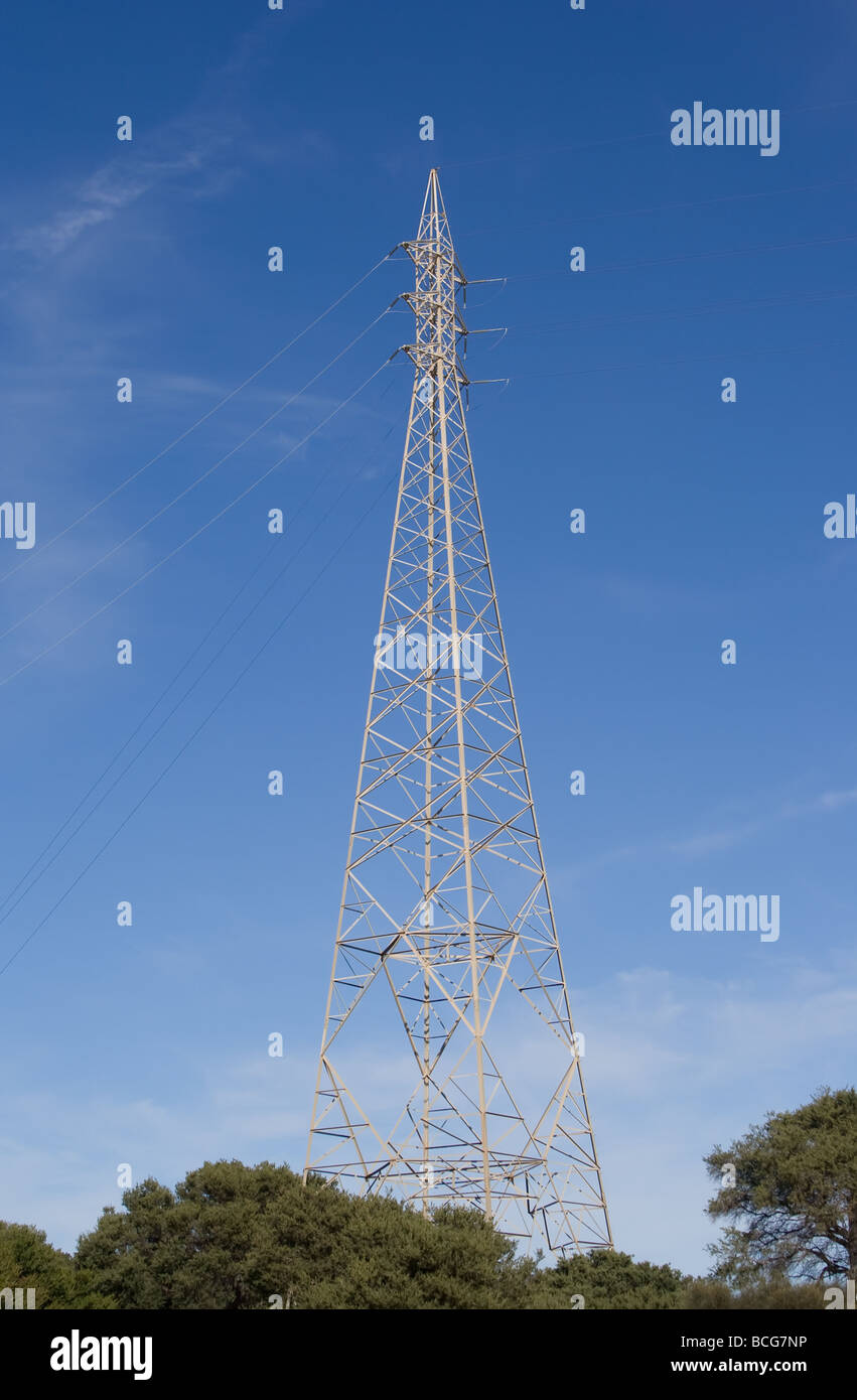 Electricity pylon against a blue sky with wispy clouds Stock Photo - Alamy