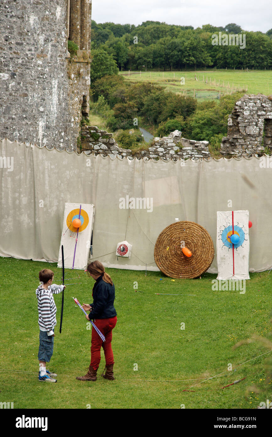 An archery lesson at Carew Castle in Pembrokeshire West Wales Stock