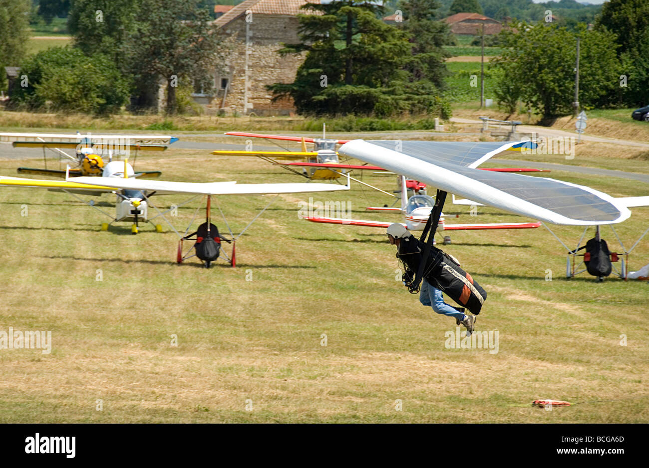 Hang glider landing at an airshow in France Stock Photo Alamy