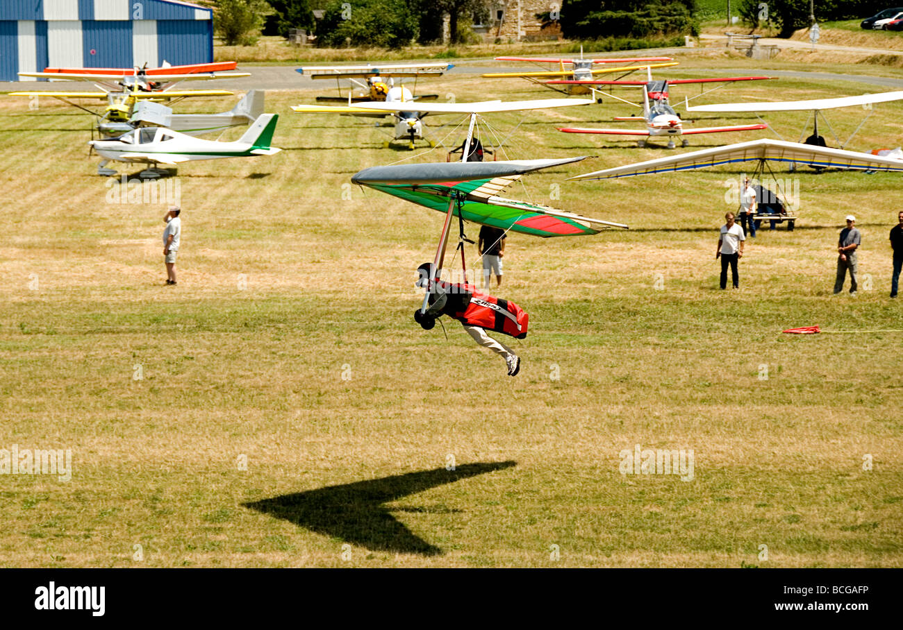 Hang glider coming in to land at an airshow in France Stock Photo