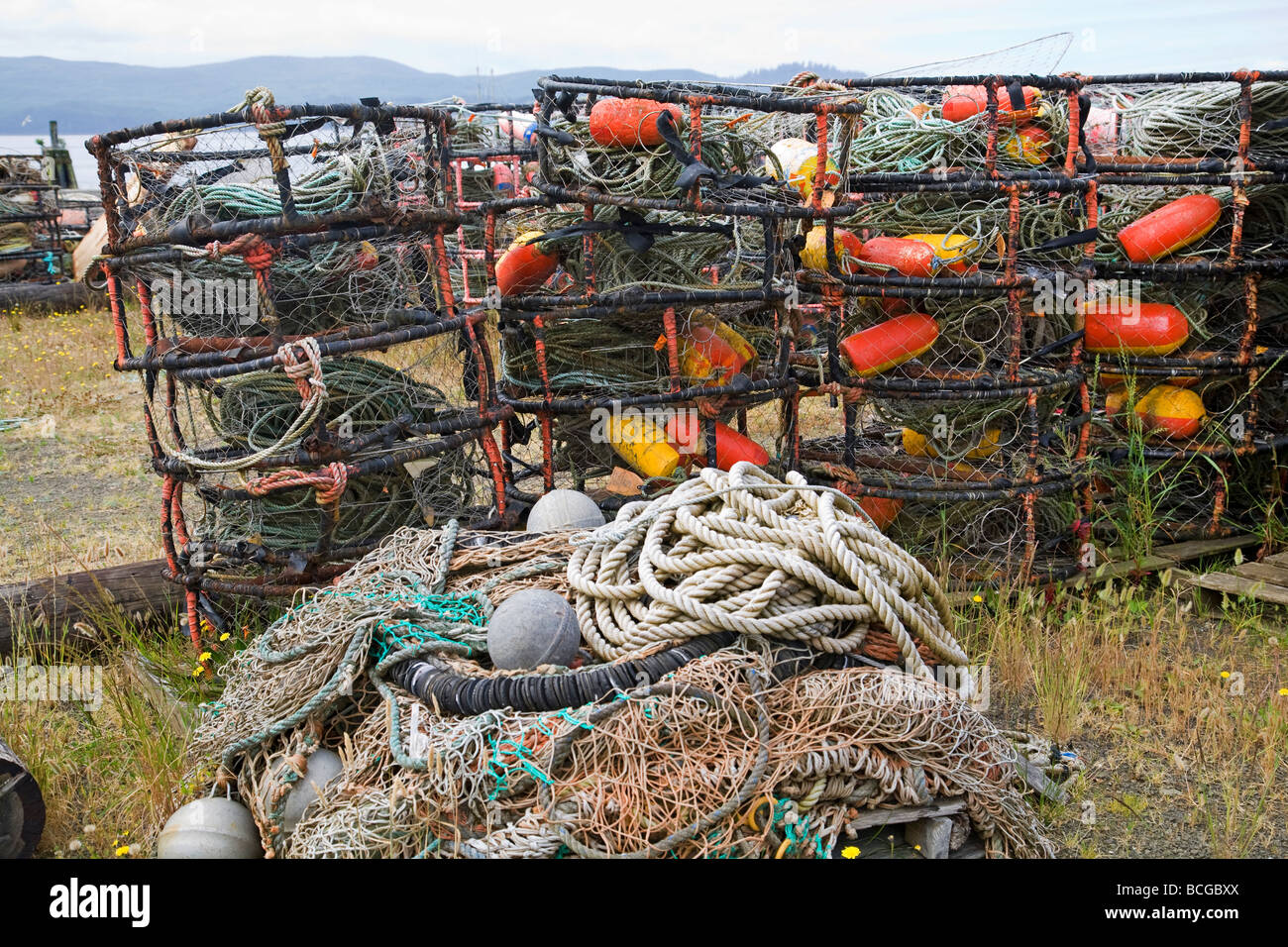 Crab pots or traps fishing nets and buoys decorate a wharf in