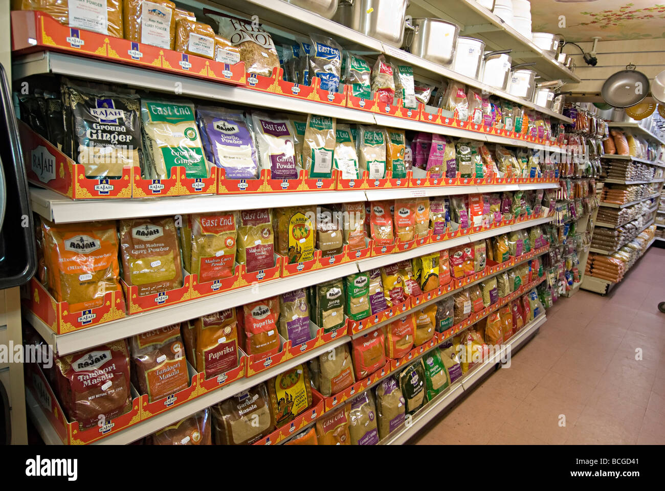 Asian Indian supermarket with shelves of spices in packets in bristol uk Stock Photo