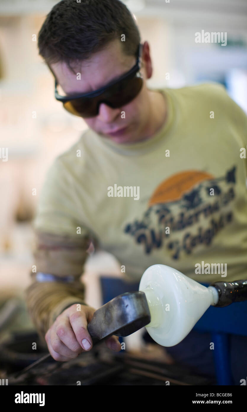 Colin Hawkins, glass blower at the Loco glass studio creating blown glass, Brewery Arts