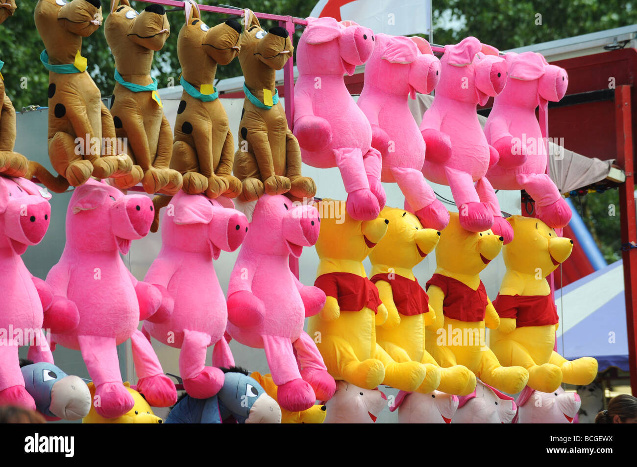 A row of cuddly toys lined up as prizes at a local fair Stock Photo Alamy