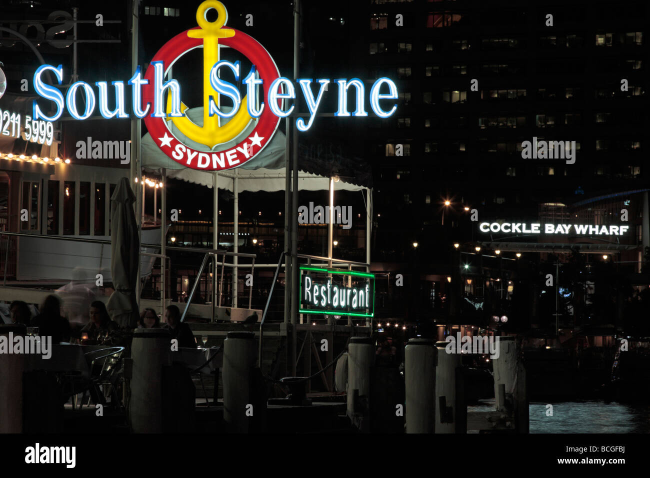 Neon signs outside restaurants in Darling Harbour Sydney New South Wales Australia Stock Photo