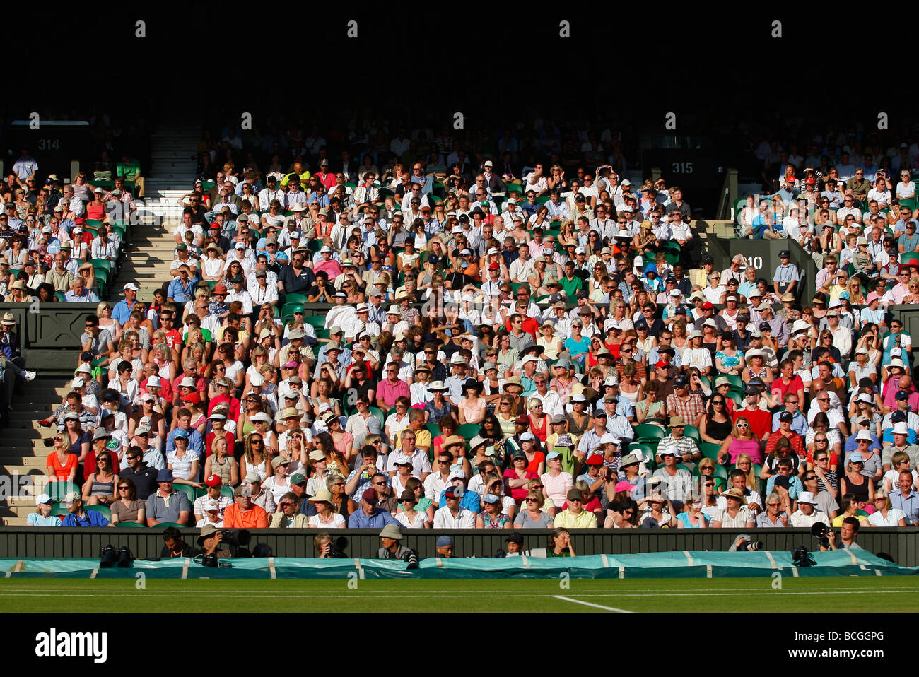 Spectators on Centre Court at the Wimbledon Championships Stock Photo