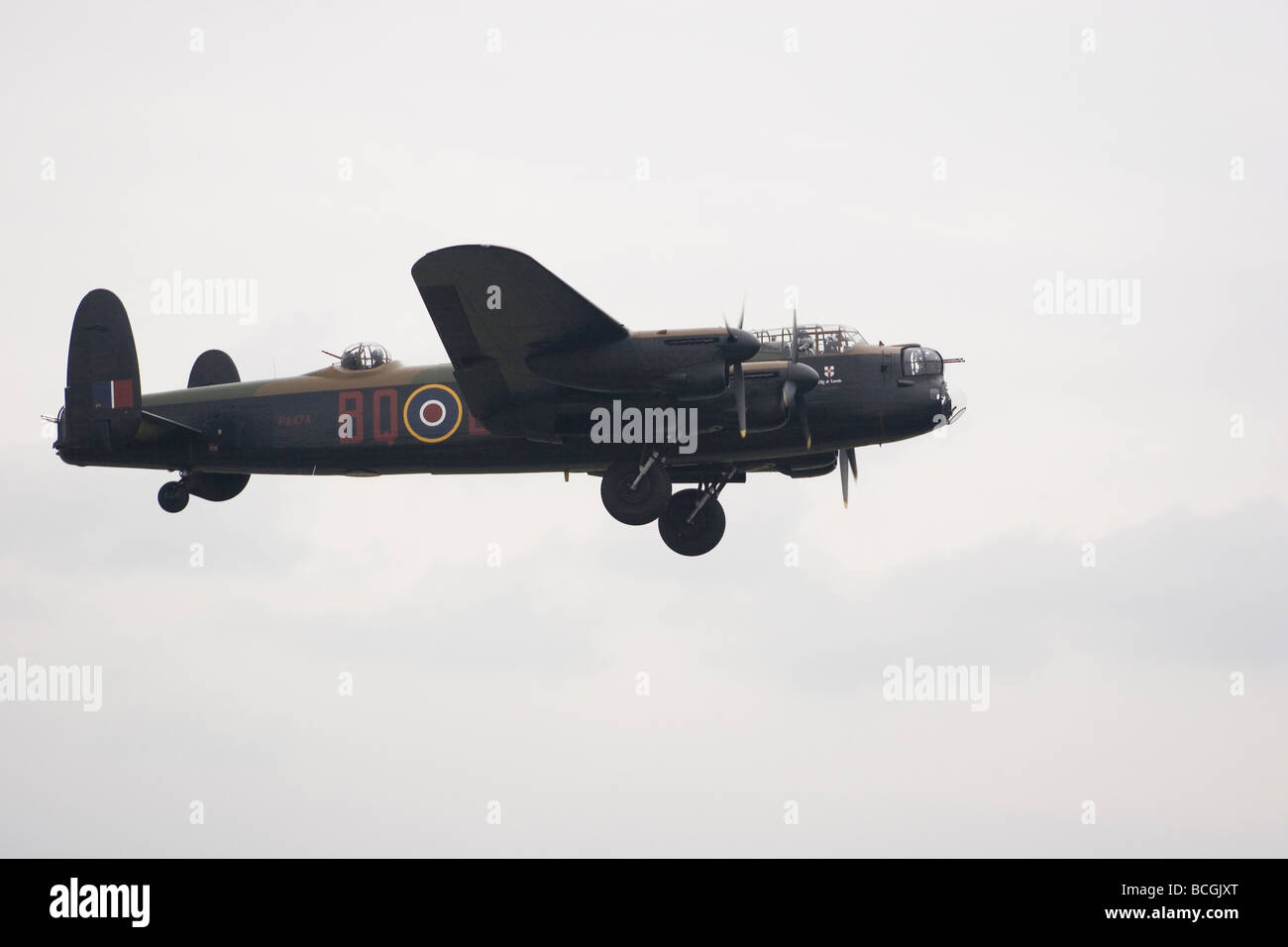 Lancaster Bomber in flight wheels down Stock Photo
