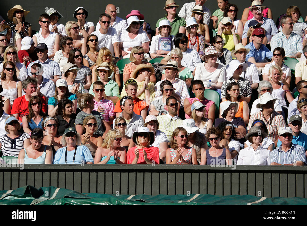 Spectators on the Centre Court at the Wimbledon Championships Stock Photo