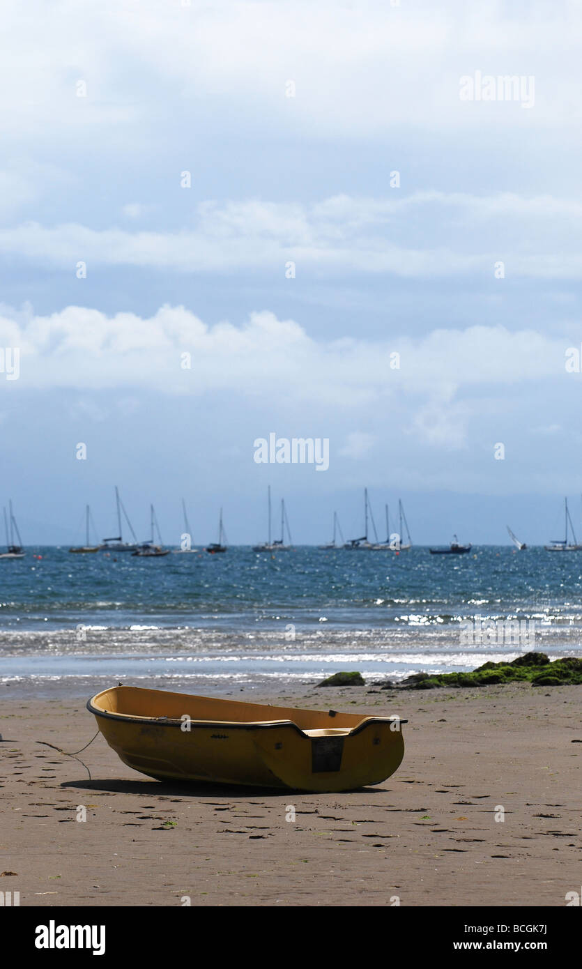 yellow tender beached at abersoch no 2737 Stock Photo