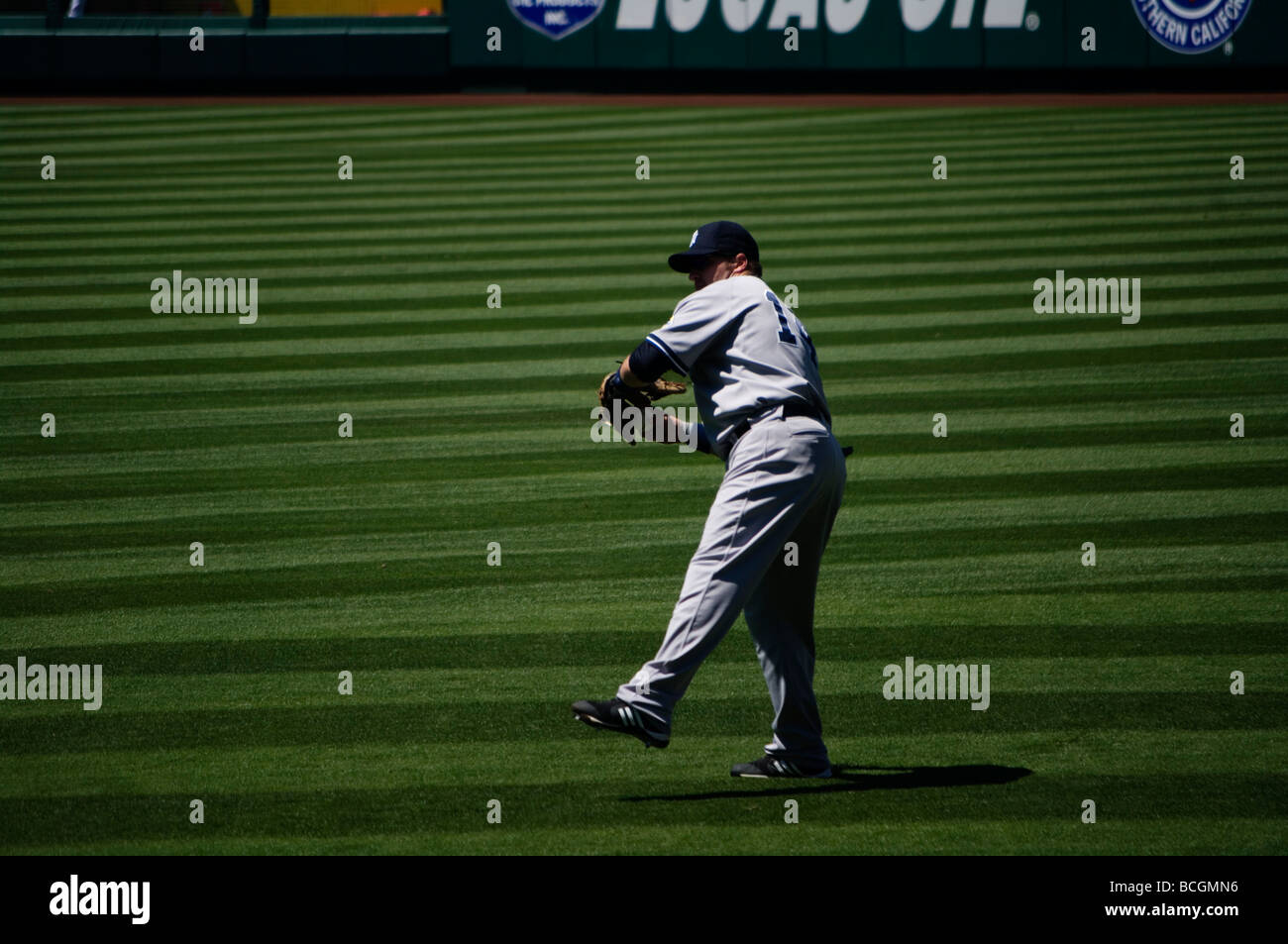Erik Hinske warms up in right field in between innings at an Angels/Yankees game. Stock Photo
