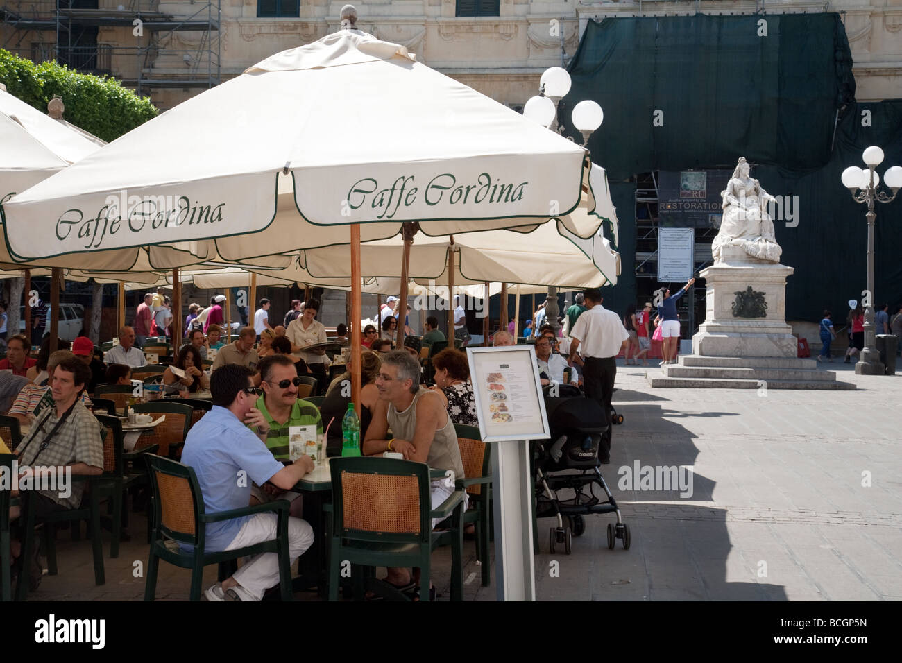Tourists eating at Caffe Cordina, Republic Square, Valletta, Malta Stock Photo
