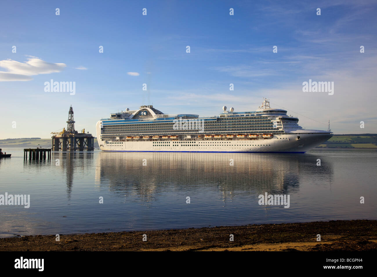Seascape & Reflections of Cruise ship. The Crown Princess British-American owned big liner arriving at Invergordon, Cromarty Firth, Scotland, UK Stock Photo