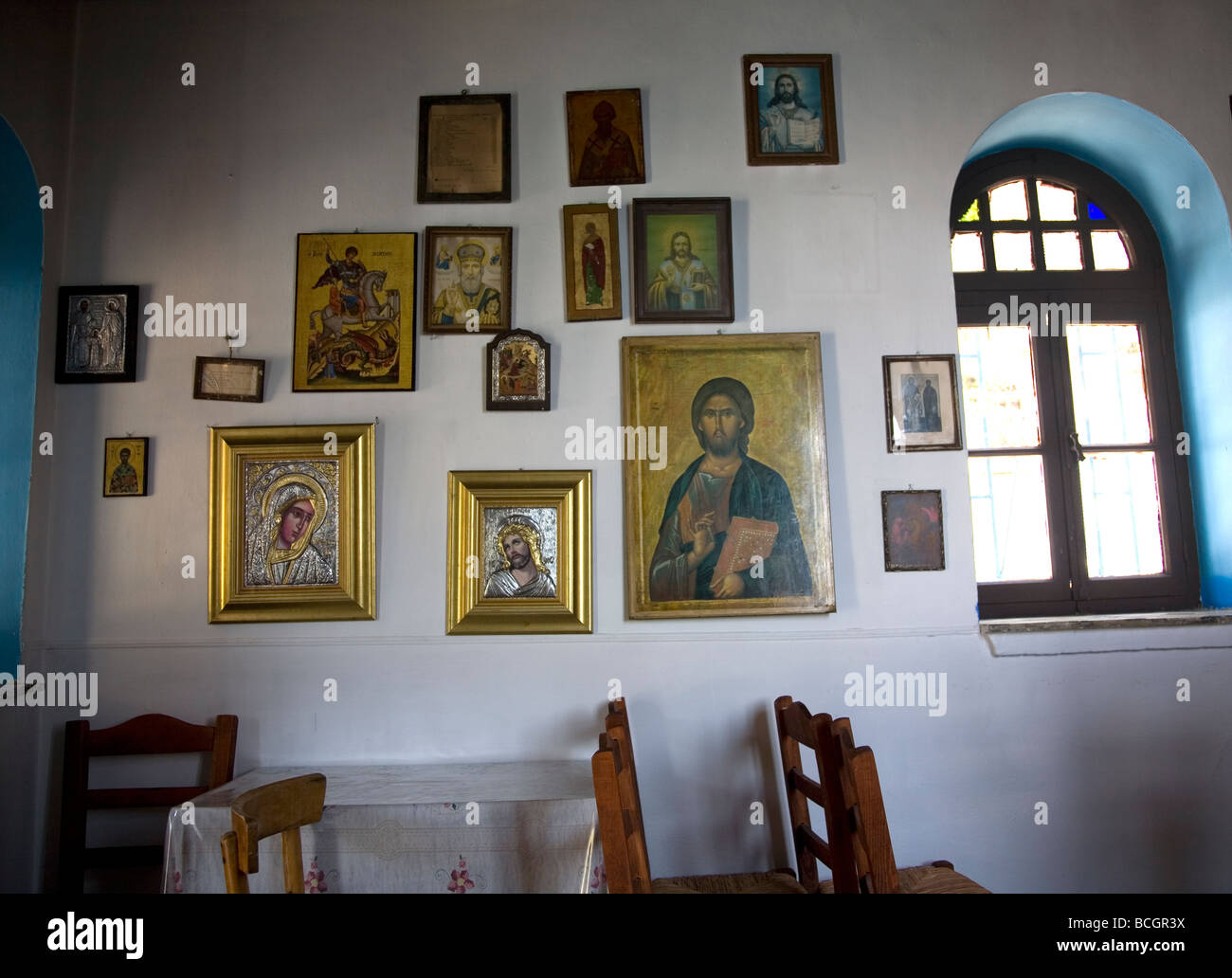 Icons on Chapel interior wall - Lesbos - Greece Stock Photo
