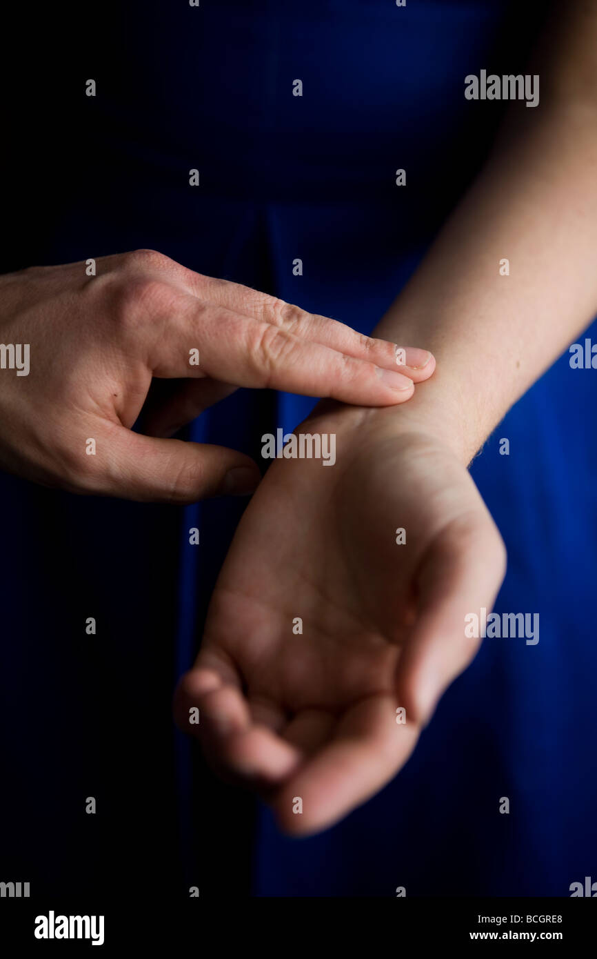 Taking a pulse reading stock photo alamy