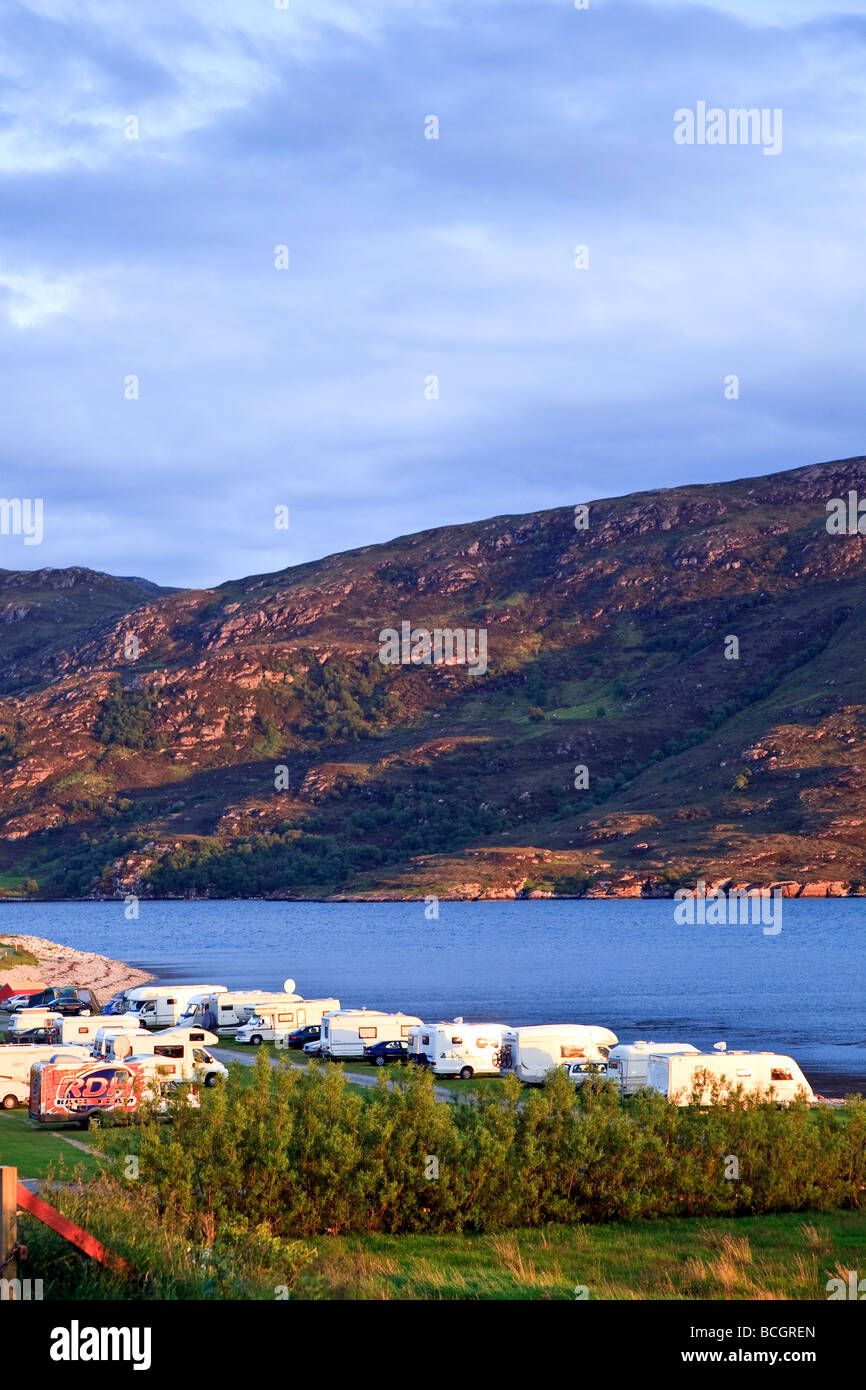 Camper vans on a campsite at sunset, Ullapool, Loch Broom, Highlands