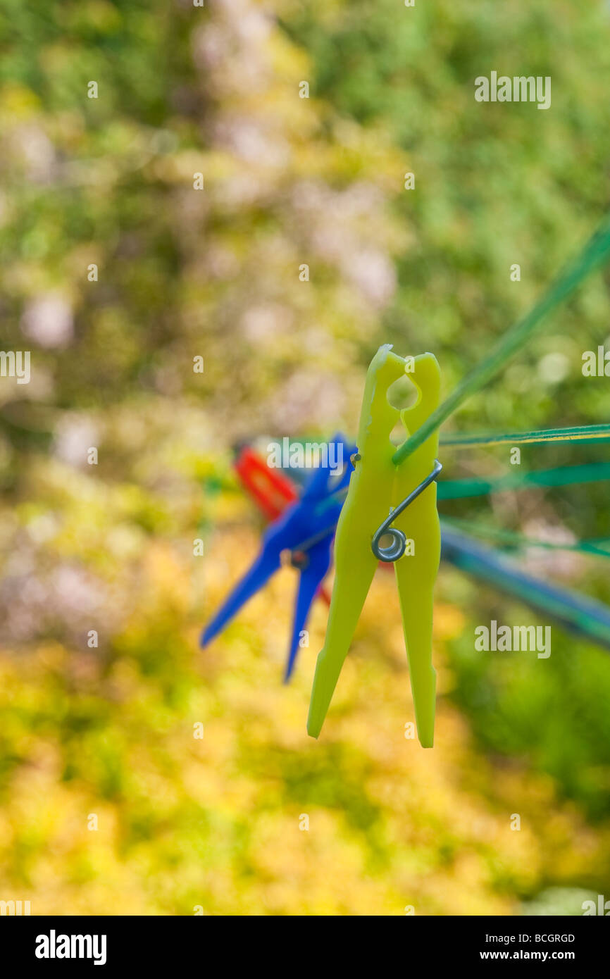 Plastic pegs on a washing-line. Stock Photo