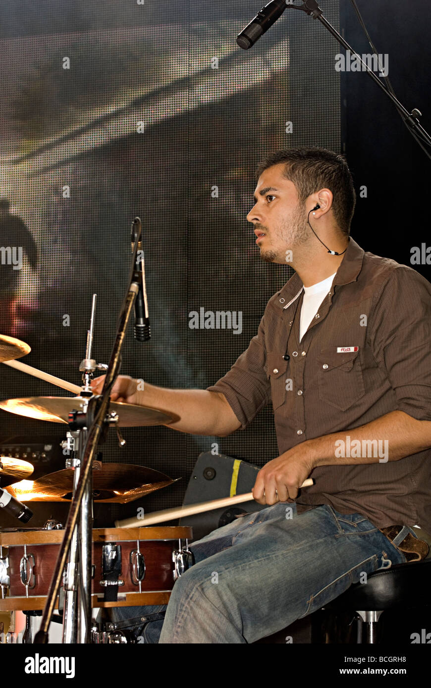 a drummer playing on stage in birmingham Stock Photo