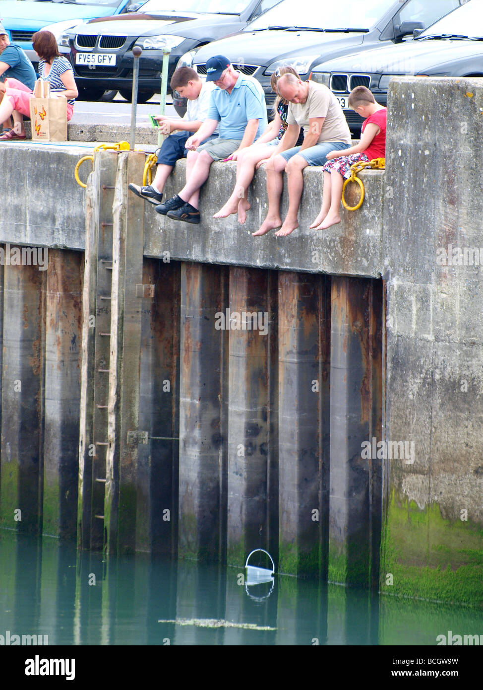 Family crabbing Padstow harbour Stock Photo Alamy