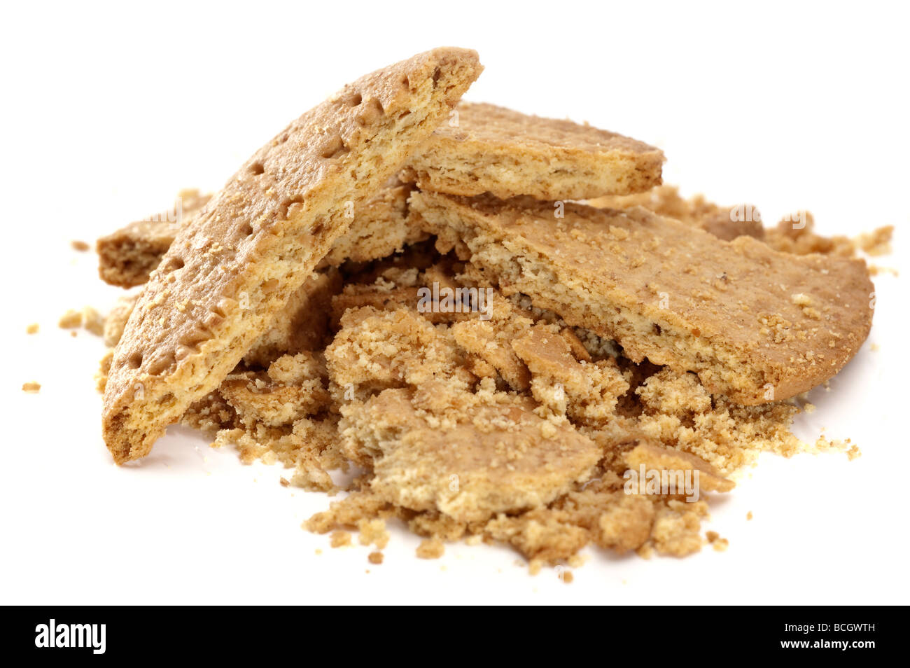 Pile of 'digestive biscuit' crumbs and broken biscuits Stock Photo