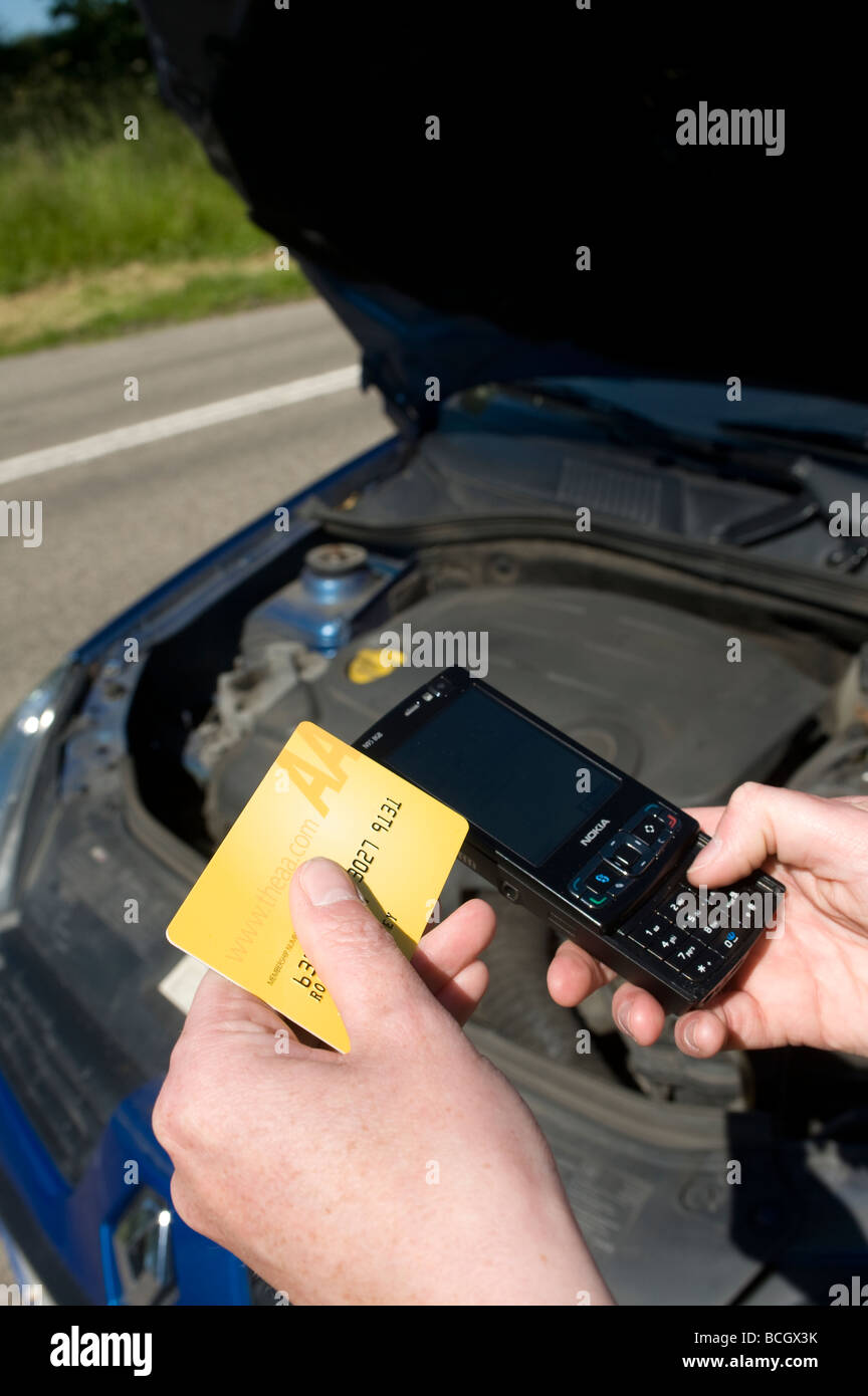 Close up of somebody using a mobile phone to ring the aa automobile association following a car breakdown Stock Photo