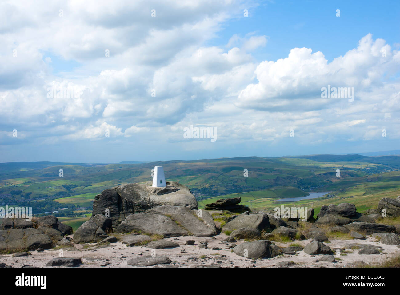 The trig point on Blackstone Edge, West Yorkshire, England UK, with a view to East Lancashire Stock Photo