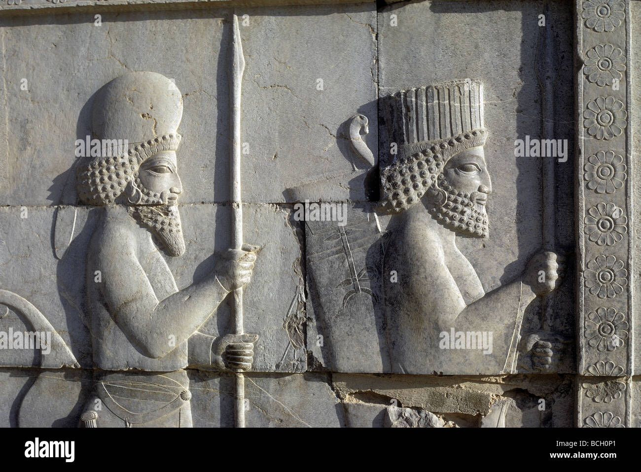Part of a bas relief of guards or nobles in Persopolis in the Islamic Republic of Iran Persopolis was inscribed as a UNESCO Stock Photo