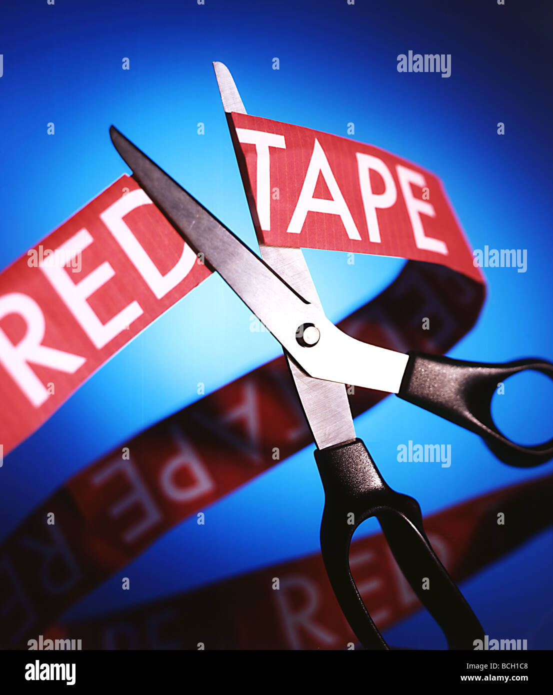 Cutting through the red tape Stock Photo Alamy