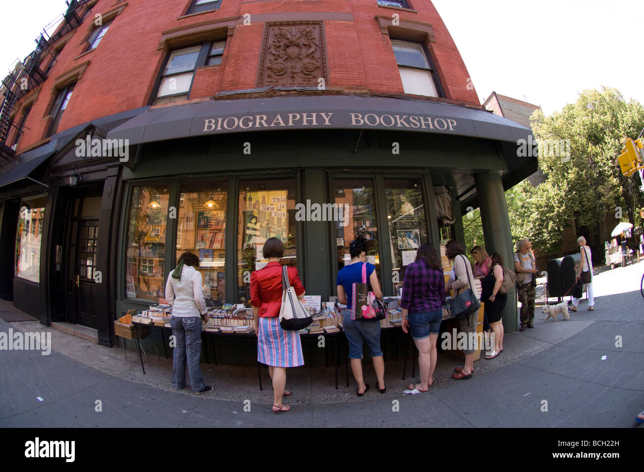 People browse at the book stalls outside the Biography Bookshop in Greenwich Village in New York Stock Photo