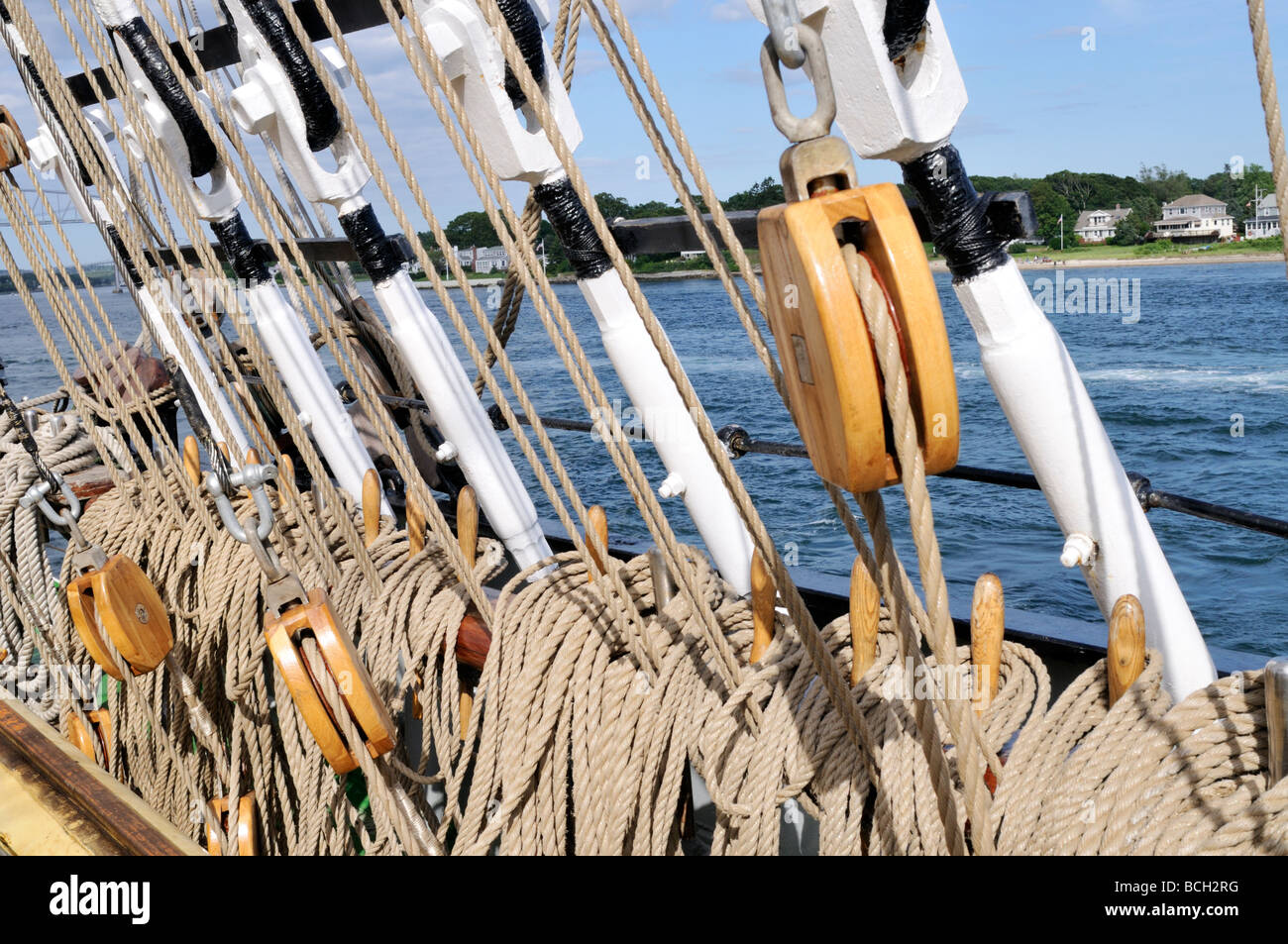 Turnbuckles blocks and tackle and lines for rigging mounted on rail of
