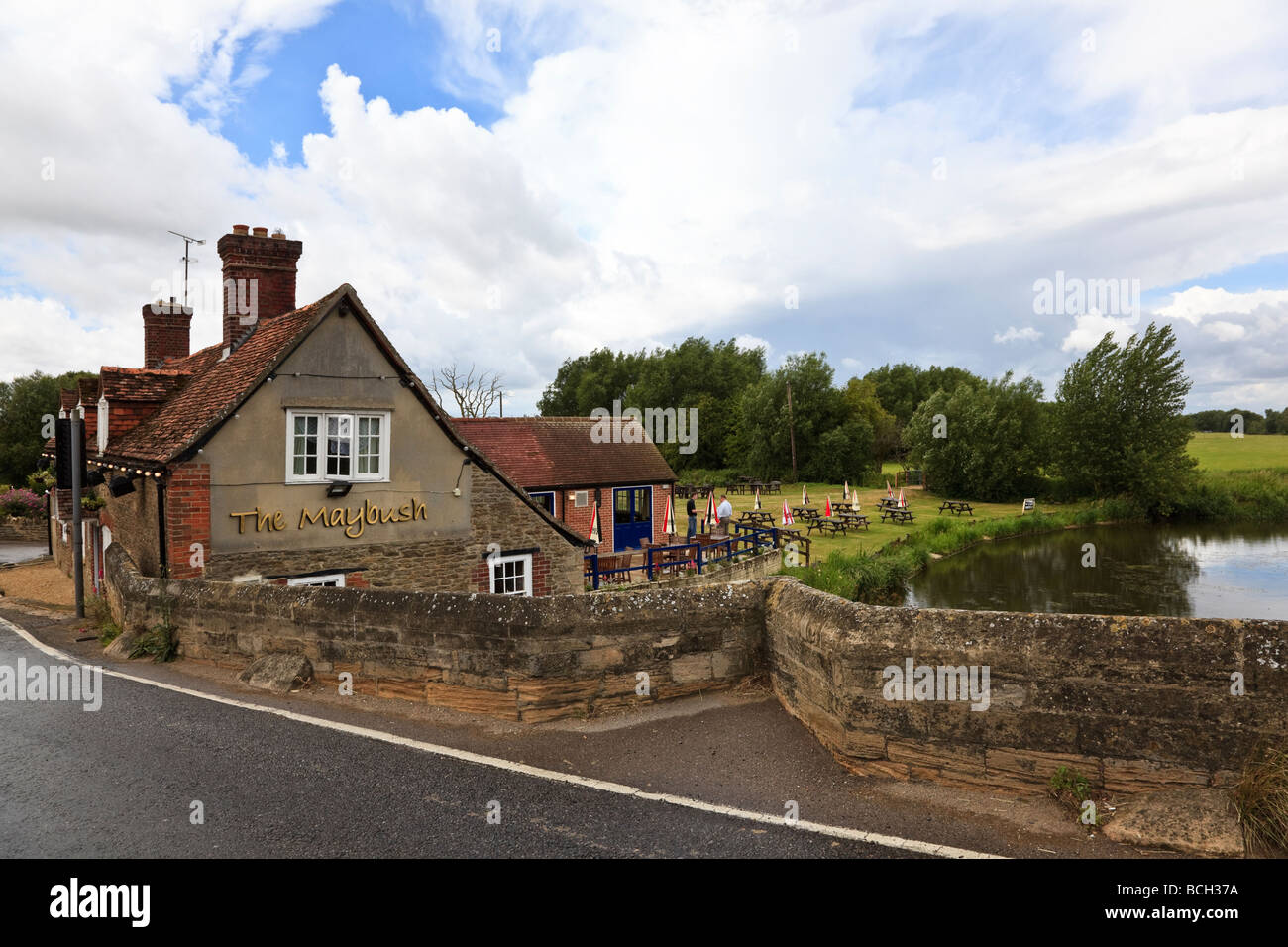 The Maybush pub by the side of the River Thames at Newbridge near