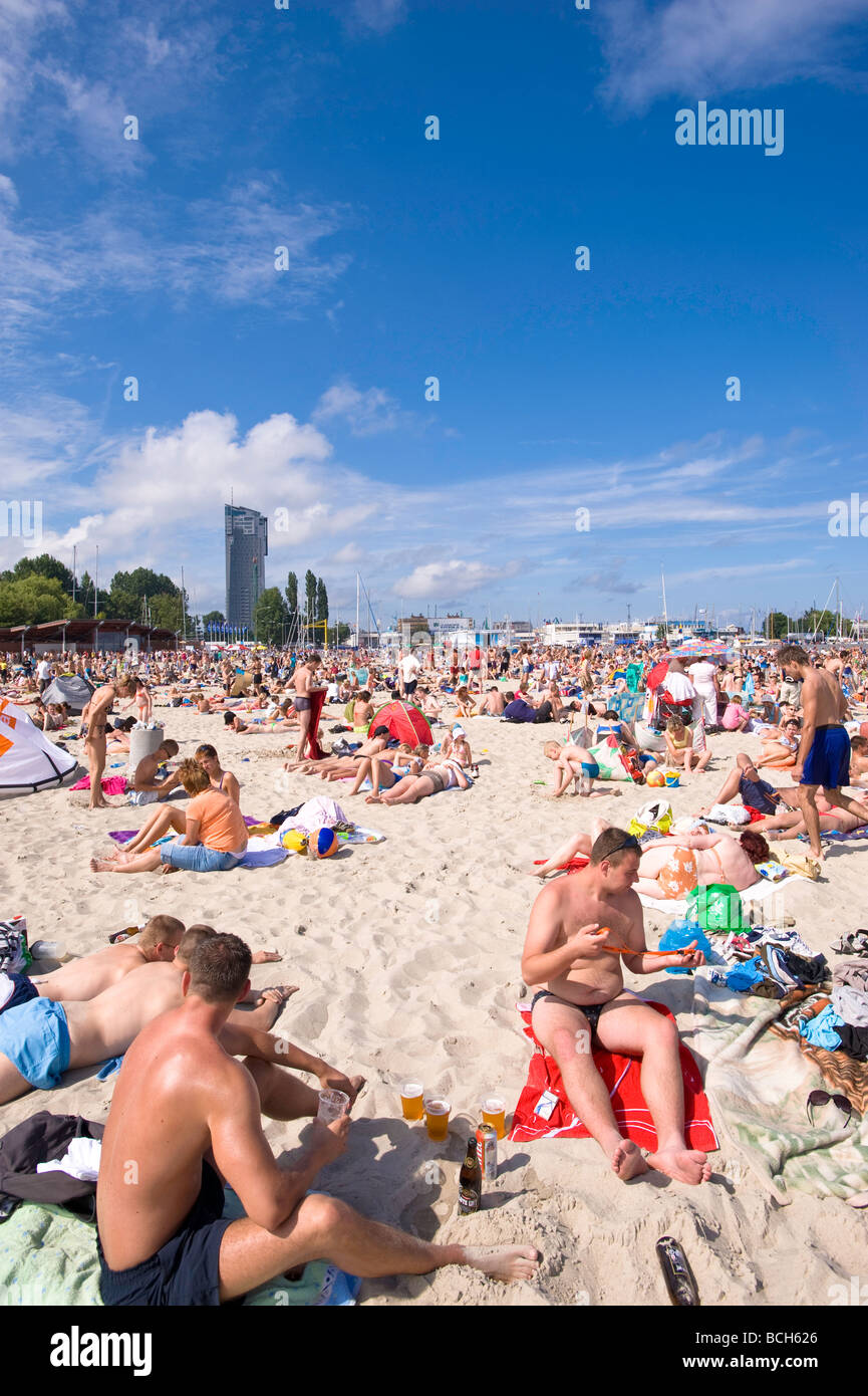 People sunbathing on sandy beach Baltic Sea Gdynia Poland Stock Photo