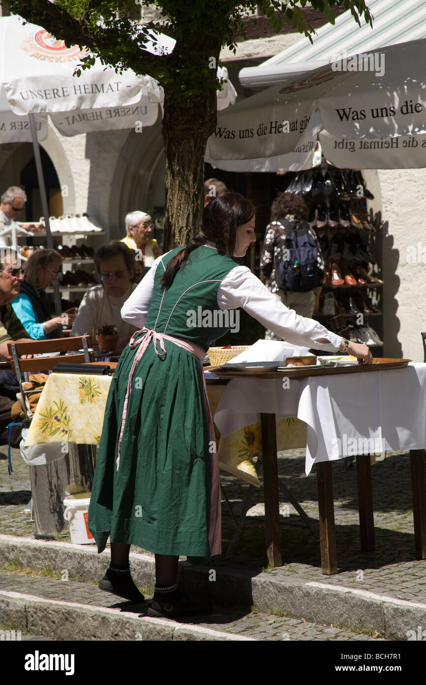 Bavaria Germany EU Waitress in national costume at an outdoor cafe Stock Photo