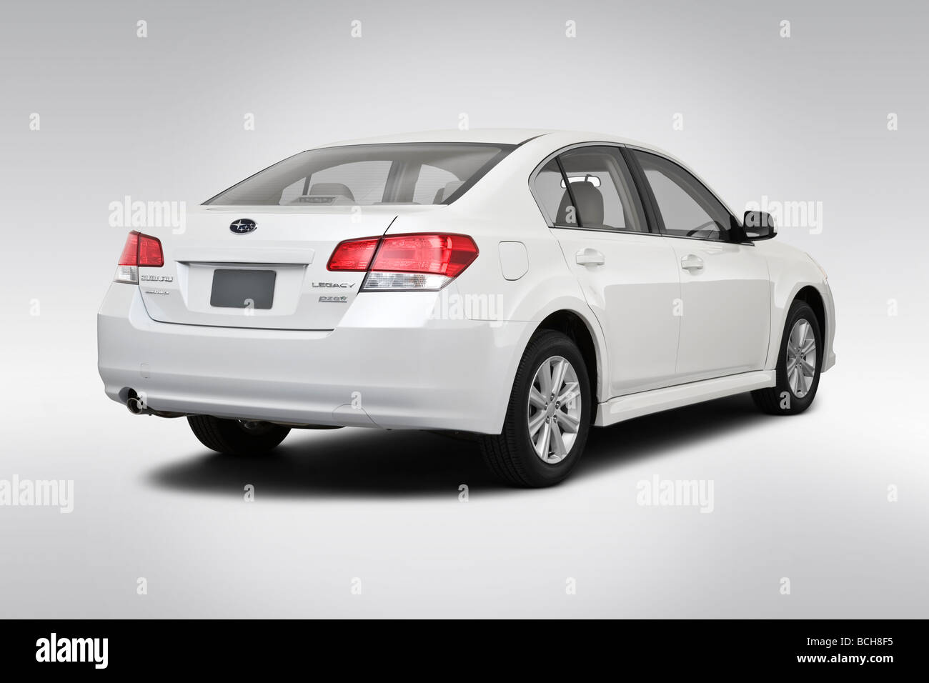 2010 Subaru Legacy 2.5i in White - Rear angle view Stock Photo