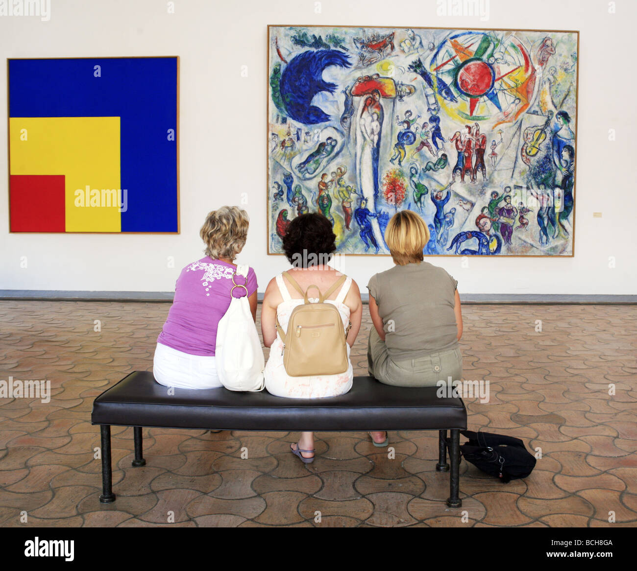 Thre Women Discuss a Marc Chagall Painting at the Maeght Fondation Gallery St Paul de Vence Provence France Stock Photo