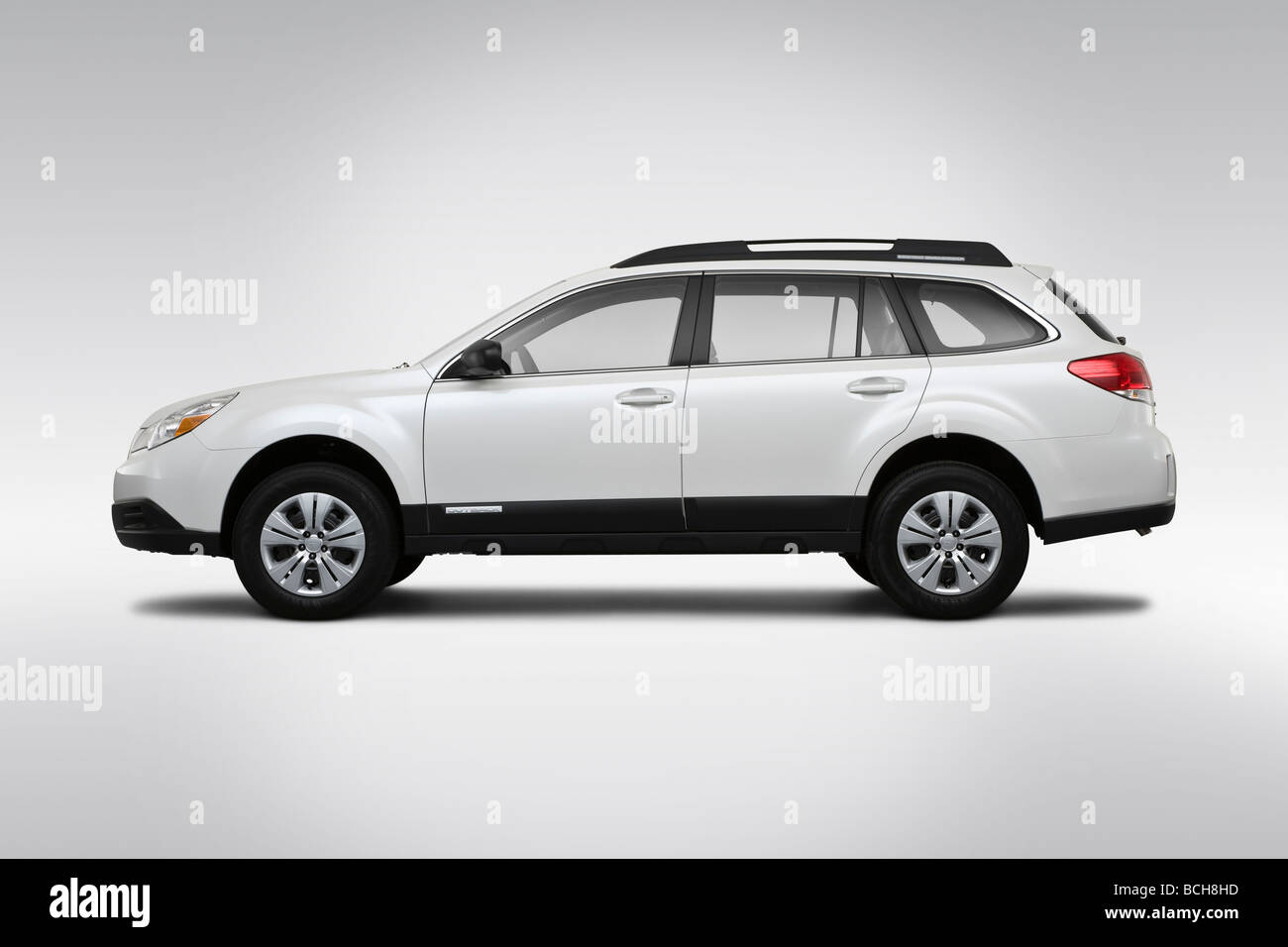 2010 Subaru Outback 2.5i in White Drivers Side Profile Stock Photo