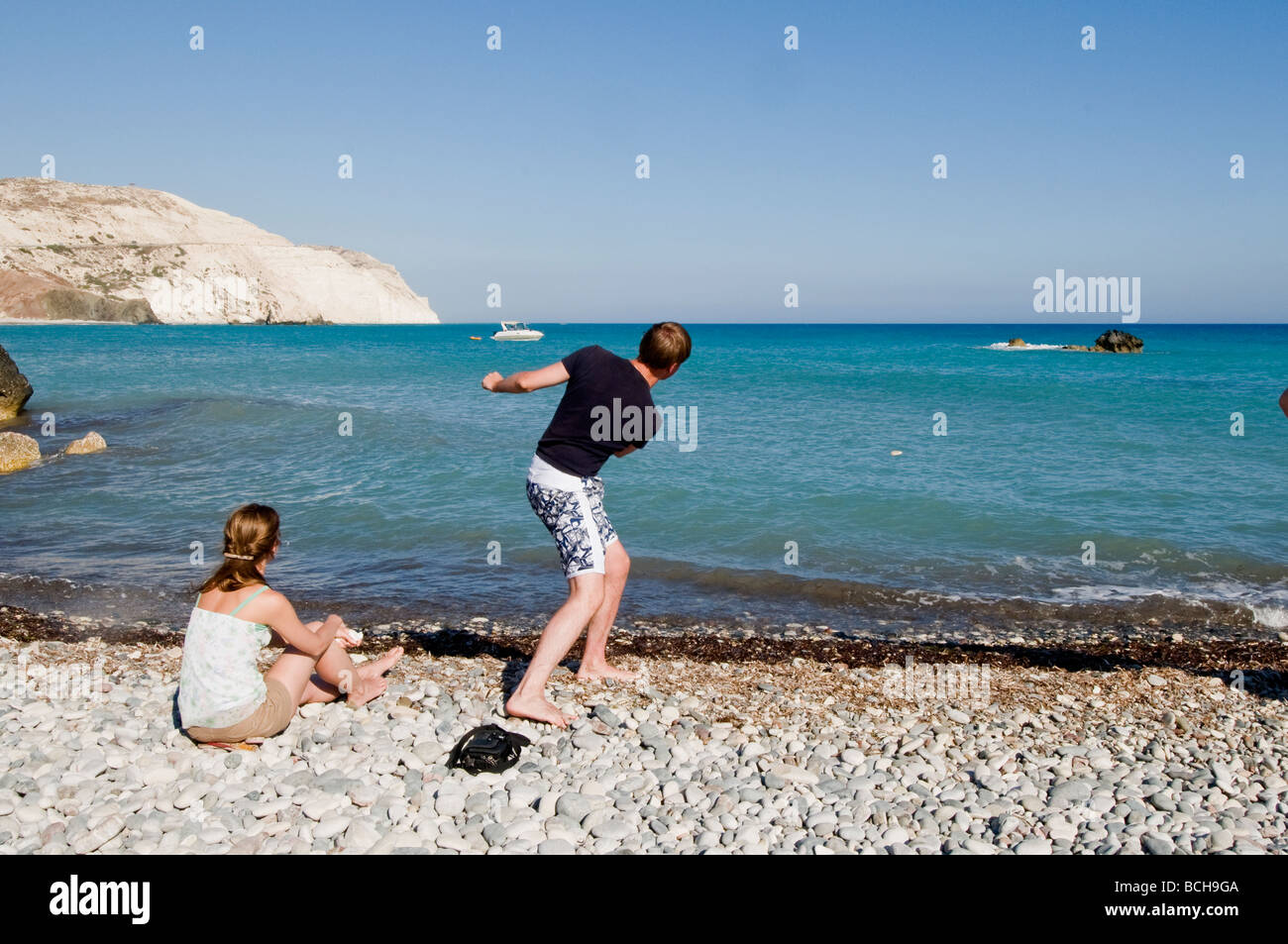 Relaxing on a peebled beach, Cyprus Stock Photo
