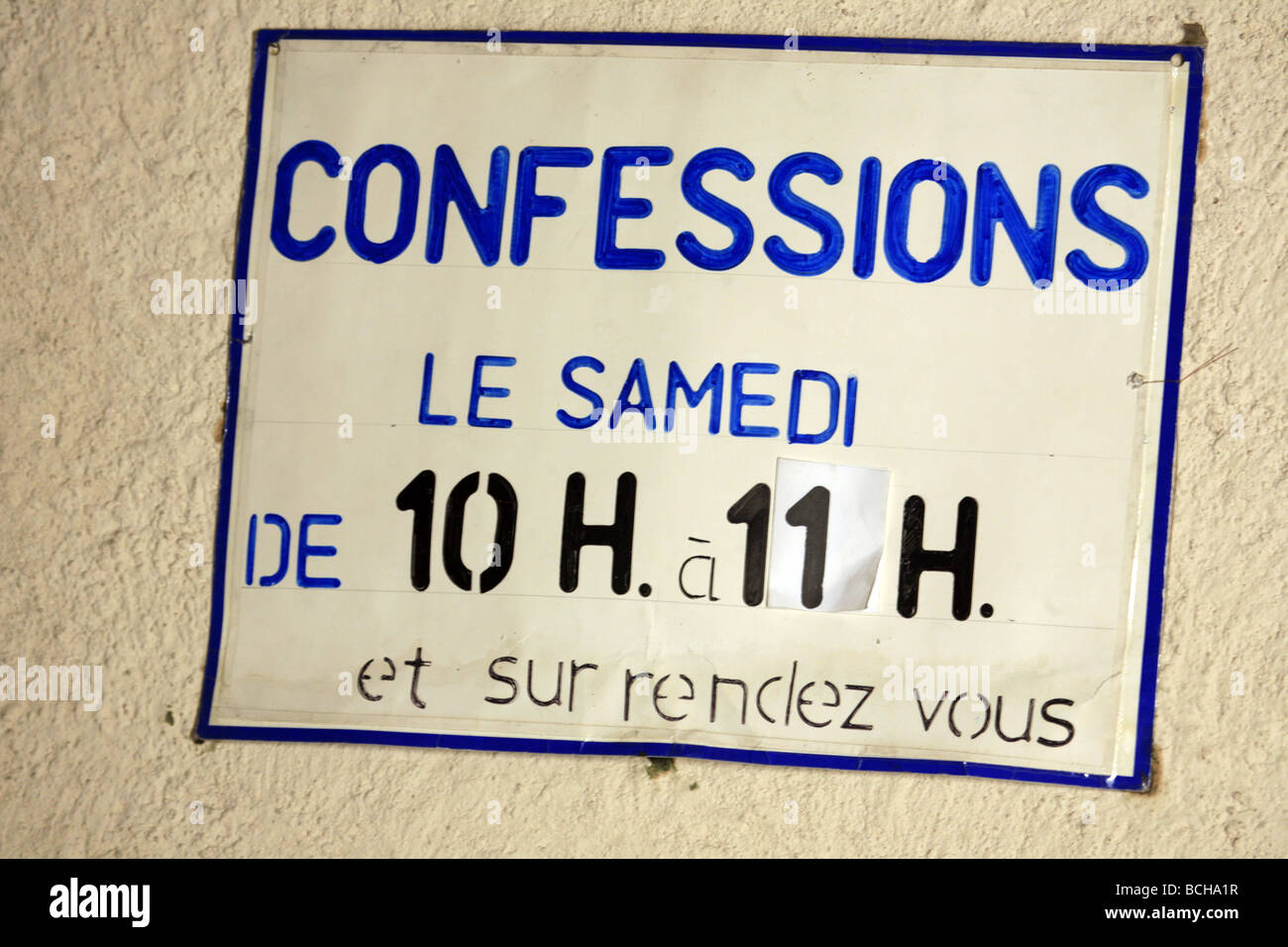 Confessions sign in cathedral Stock Photo