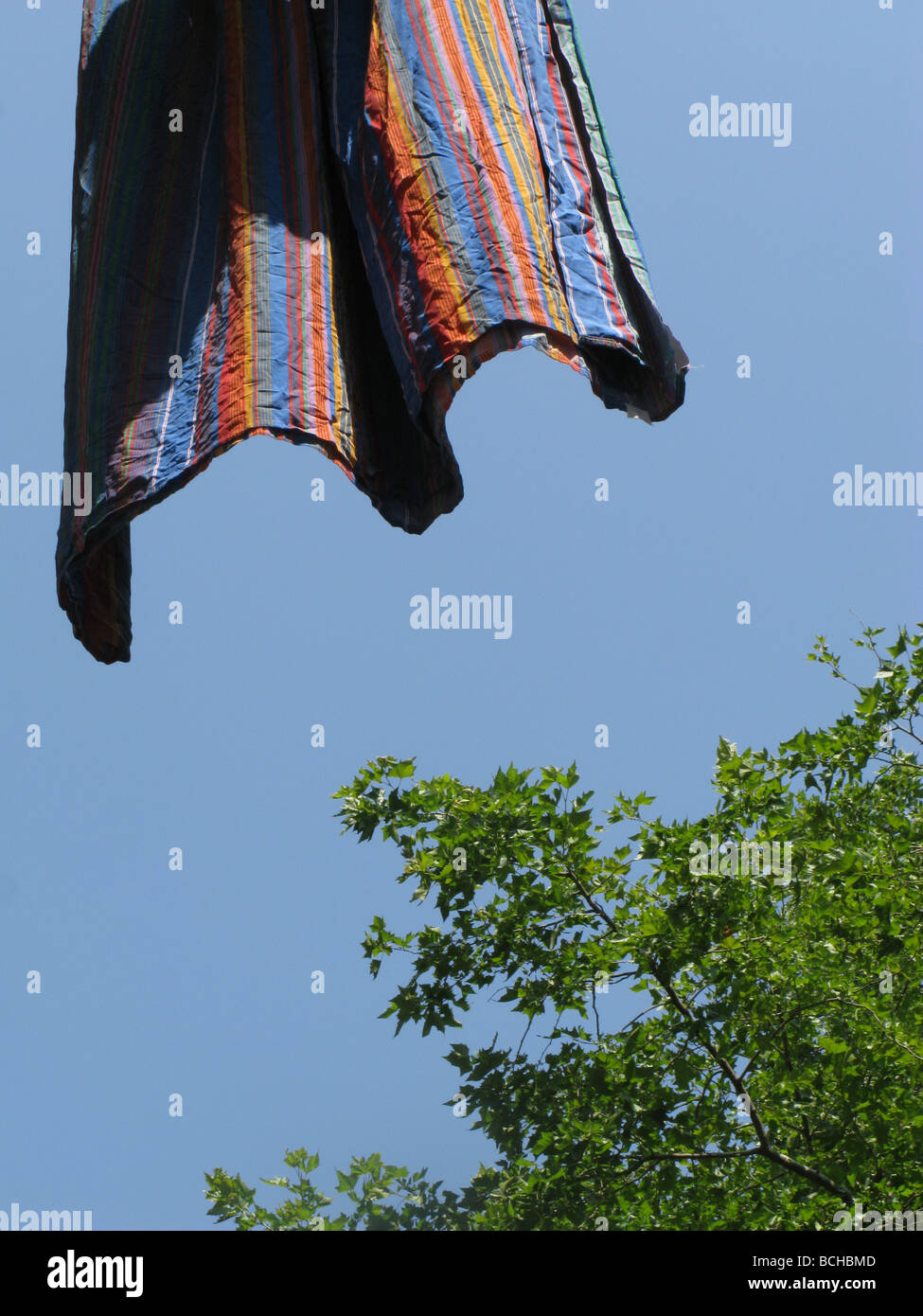 stripes bed sheet hanging on washing line in sun Stock Photo Alamy