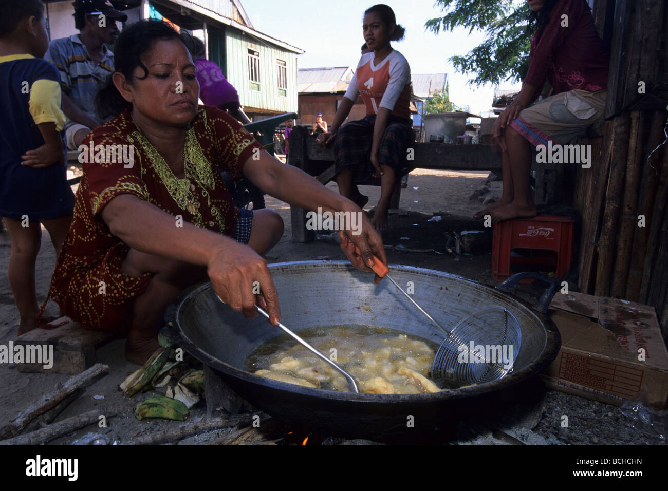 Woman frying Bananas on Komodo Island Komodo National Park Lesser Sunda Islands UNESCO World Heritage Site Indonesia Stock Photo