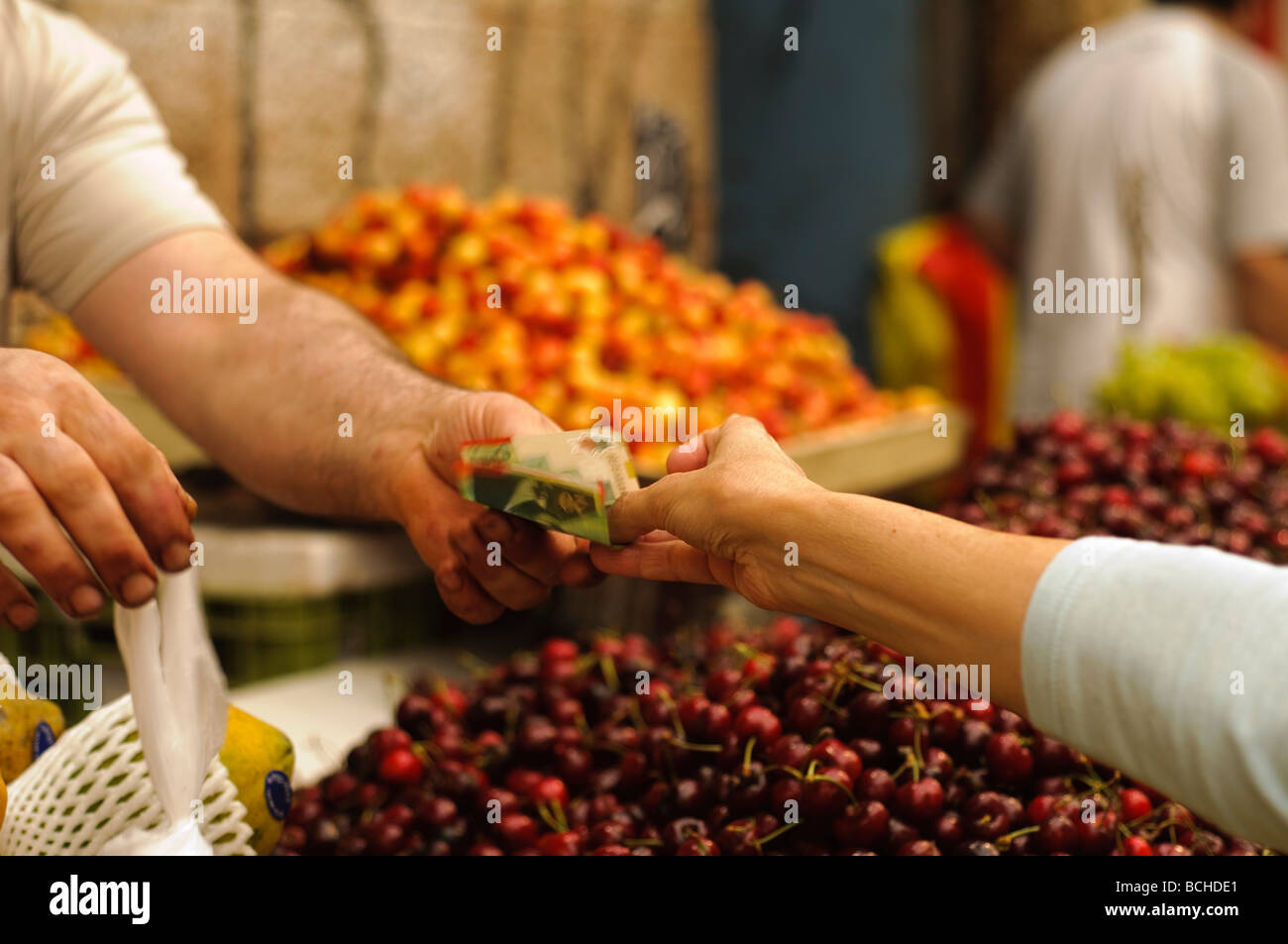 Israel Jerusalem Machane Yehuda market Money changing hands buyer paying for goods Stock Photo