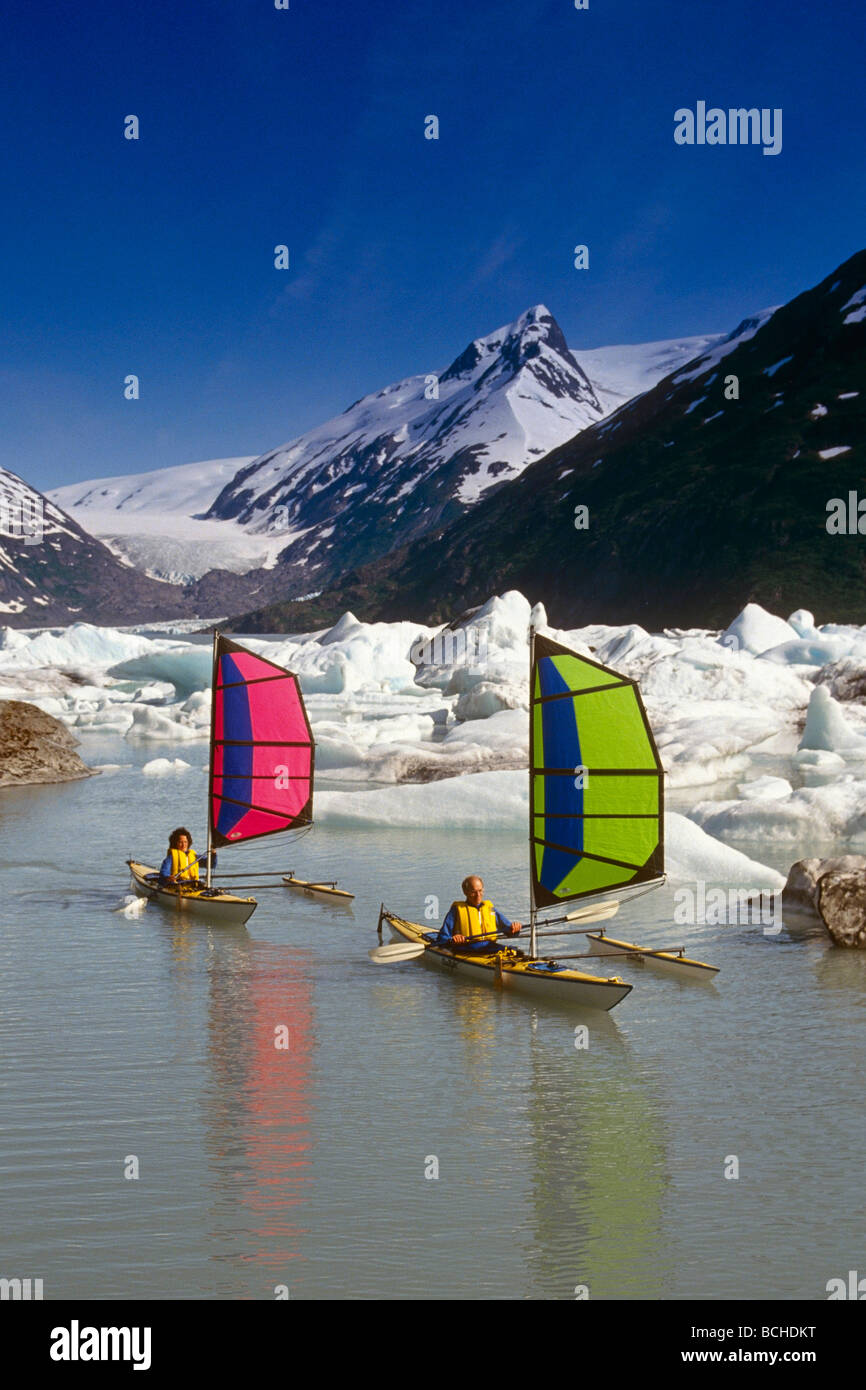 Kayakers Windsailing in Portage Lake SC Alaska /nSpring Stock Photo