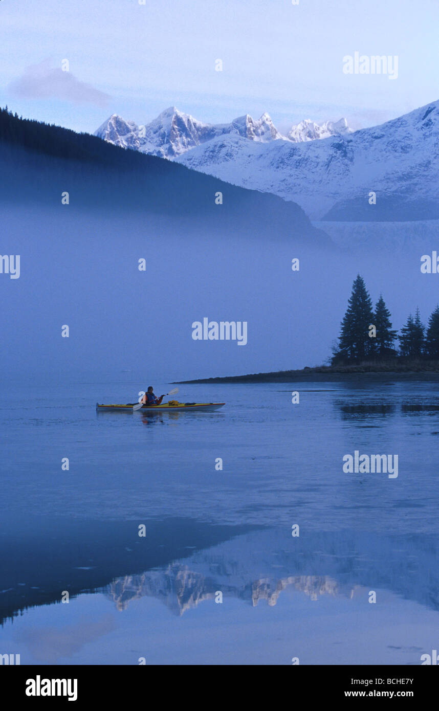 Kayaker on Foggy Mendenhall Lake Winter SE Alaska Stock Photo
