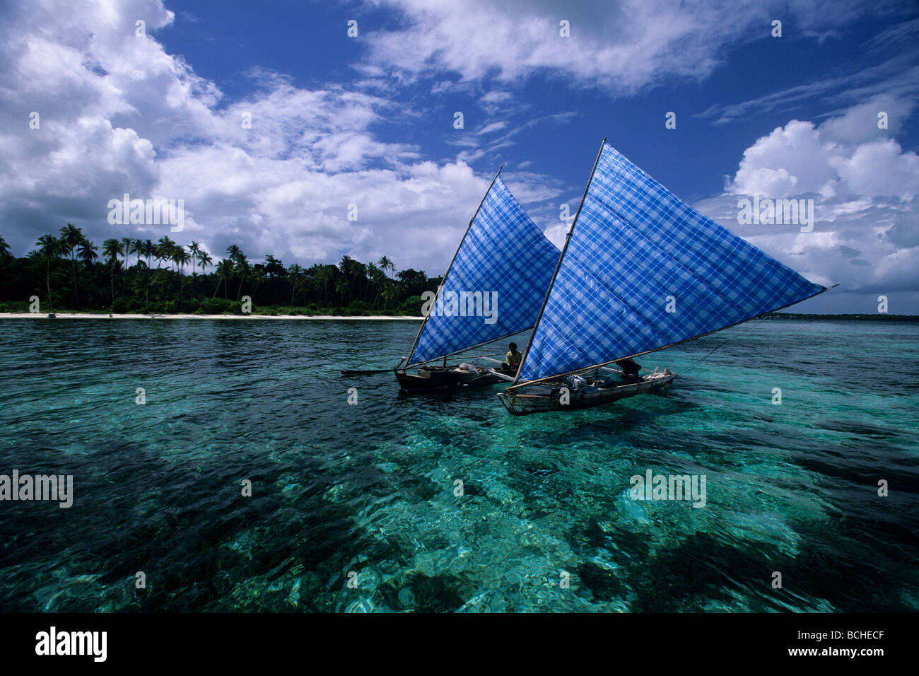 Fisherman with traditional Outrigger Boats Wakatobi Celebes Indo Pacific Indonesia Stock Photo