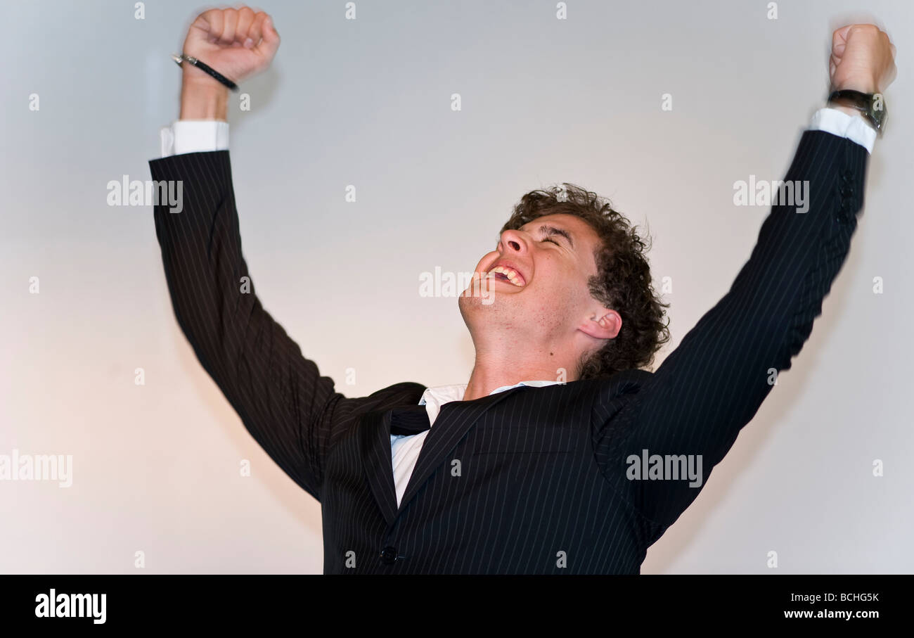 young business man cheers Stock Photo Alamy